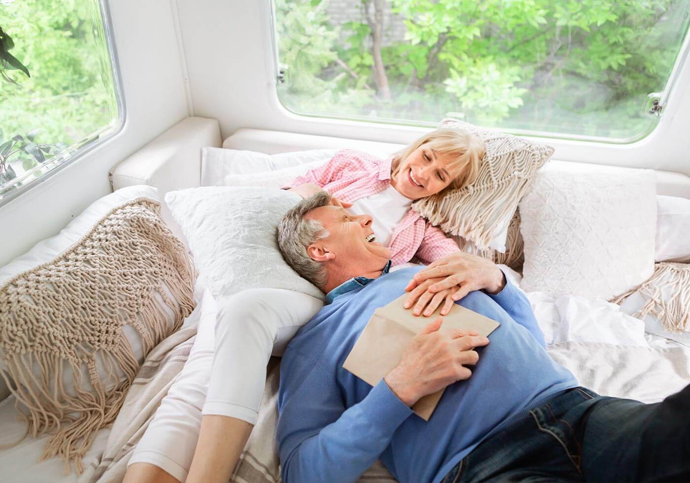 Couple relaxing together inside an RV